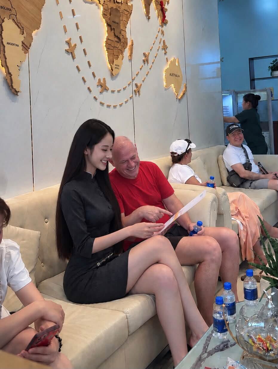 Chloe smiling while talking with a guest at the clinic