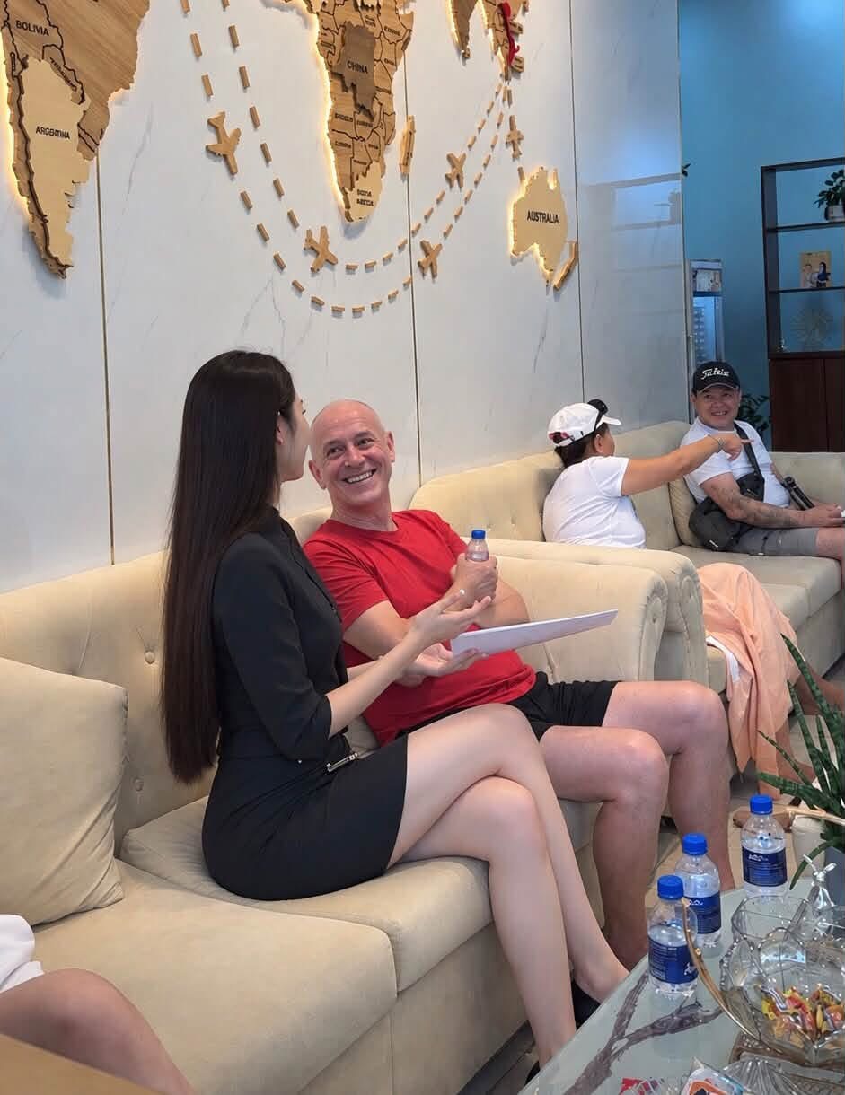 Chloe speaking with a guest in the seating area